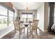 Charming dining room features a chandelier and windows, creating an inviting atmosphere for meals at 2675 Cottage Ct, Brownsburg, IN 46112