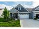 Charming single-Gathering home featuring stone accents, a two-car garage, and well-maintained landscaping at 2675 Cottage Ct, Brownsburg, IN 46112