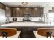 Spacious kitchen featuring stainless steel appliances, a large island with seating, and ample natural light at 2675 Cottage Ct, Brownsburg, IN 46112
