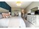 Serene main bedroom with a stylish accent wall, plush bedding, and tasteful decor at 2675 Cottage Ct, Brownsburg, IN 46112