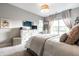 Cozy main bedroom with neutral tones, large windows, and plush carpet creating a relaxing retreat at 2675 Cottage Ct, Brownsburg, IN 46112