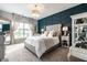 Elegant main bedroom featuring a statement wall, plush carpeting, and bright natural light at 2675 Cottage Ct, Brownsburg, IN 46112