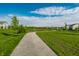 Picturesque walking path through the community with mature trees and pond views at 2675 Cottage Ct, Brownsburg, IN 46112