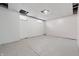 Unfinished basement with bright white walls and dual windows, offering remodel potential at 309 Poplar Rd, Indianapolis, IN 46219
