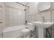 Bathroom with shower-tub combo and tile surround at 309 Poplar Rd, Indianapolis, IN 46219