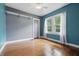An empty bedroom features hardwood floors and ample natural light at 309 Poplar Rd, Indianapolis, IN 46219