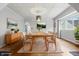 Dining room features a wooden table, seating for eight, and modern lighting at 309 Poplar Rd, Indianapolis, IN 46219