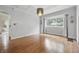 Empty dining area with natural lighting and hardwood floors at 309 Poplar Rd, Indianapolis, IN 46219