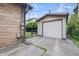 View of detached one car garage with room for parking on drive at 309 Poplar Rd, Indianapolis, IN 46219