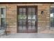 Cozy screened-in porch with brick wall and security door at 309 Poplar Rd, Indianapolis, IN 46219