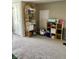 Neutral toned attic featuring a wicker shelf and organized storage at 310 S Butler Ave, Indianapolis, IN 46219