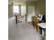 Carpeted attic space featuring a sewing machine and bright natural light at 310 S Butler Ave, Indianapolis, IN 46219