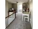 Bright attic area with natural light, neutral walls and plush carpeting at 310 S Butler Ave, Indianapolis, IN 46219