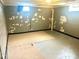 Unfinished basement with painted walls and floors, ready for customization with potential for added living space at 310 S Butler Ave, Indianapolis, IN 46219