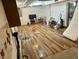 Large basement with hardwood floors, TV, fan, furniture and room for entertaining or storage at 310 S Butler Ave, Indianapolis, IN 46219