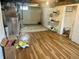 Unfinished basement featuring tiled floors, utility equipment and ample storage space at 310 S Butler Ave, Indianapolis, IN 46219