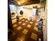 Basement laundry room with checkerboard flooring and washer and dryer at 310 S Butler Ave, Indianapolis, IN 46219