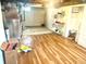 Large unfinished basement with updated floors, lighting, and ample space for storage or customization at 310 S Butler Ave, Indianapolis, IN 46219