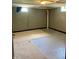 Basement area featuring painted block walls and carpeted area at 310 S Butler Ave, Indianapolis, IN 46219