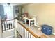 Bright bonus room with white table and chairs, ample storage, and natural light from large window at 310 S Butler Ave, Indianapolis, IN 46219