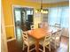 Inviting dining room with hardwood floors, chandelier, and built-in display cabinets at 310 S Butler Ave, Indianapolis, IN 46219