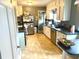 Efficient kitchen featuring neutral countertops, stainless steel appliances, and ample storage at 310 S Butler Ave, Indianapolis, IN 46219
