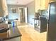 Functional kitchen featuring durable floors, stainless steel appliances, and ample counter space at 310 S Butler Ave, Indianapolis, IN 46219