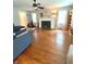 Spacious living room with hardwood floors, fireplace, and built-in bookshelves at 310 S Butler Ave, Indianapolis, IN 46219