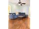 Comfortable living room with hardwood floors, large couch, and glass coffee table at 310 S Butler Ave, Indianapolis, IN 46219