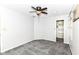 Bedroom featuring neutral walls, carpeted floor, ceiling fan and closet with organizers at 310 Wellington Overlook, Noblesville, IN 46060