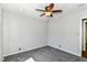 Neutral bedroom featuring plush gray carpeting and a ceiling fan with lights at 310 Wellington Overlook, Noblesville, IN 46060