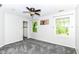 Bedroom featuring neutral walls, carpeted floor, ceiling fan and windows with treed view at 310 Wellington Overlook, Noblesville, IN 46060