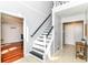 Inviting entryway with staircase, tile flooring, and neutral paint at 310 Wellington Overlook, Noblesville, IN 46060