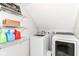 Modern laundry room with washer, dryer, wire shelving, and ample storage at 310 Wellington Overlook, Noblesville, IN 46060