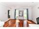 Inviting living room with natural light, hardwood floors, stylish curtains and a modern writing desk and bookshelf at 310 Wellington Overlook, Noblesville, IN 46060