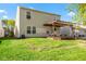Large backyard with a deck, pergola, and plenty of lawn space at 3119 Earlswood Ln, Indianapolis, IN 46217