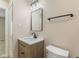 Bathroom features a modern vanity with a white countertop and a toilet at 3119 Earlswood Ln, Indianapolis, IN 46217