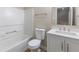 Bathroom featuring a shower-tub, toilet, vanity with sink, and a mirror at 3119 Earlswood Ln, Indianapolis, IN 46217
