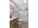 Bathroom with a standing shower and stylish wooden vanity at 3119 Earlswood Ln, Indianapolis, IN 46217