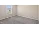 Bright bedroom featuring neutral walls, carpet floors, and a window with blinds at 3119 Earlswood Ln, Indianapolis, IN 46217
