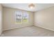 This bedroom has neutral walls, carpet and a modern light fixture at 3119 Earlswood Ln, Indianapolis, IN 46217