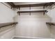 Walk-in closet with dark wood shelves at 3119 Earlswood Ln, Indianapolis, IN 46217