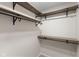 Walk-in closet boasts custom wood shelving and metal rods for maximum storage space at 3119 Earlswood Ln, Indianapolis, IN 46217