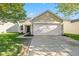 Charming single-Gathering home featuring a two-car garage, front yard, and a well-manicured lawn at 3119 Earlswood Ln, Indianapolis, IN 46217