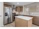 Modern kitchen featuring stainless steel appliances, a central island, and stylish cabinetry at 3119 Earlswood Ln, Indianapolis, IN 46217