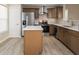 Modern kitchen featuring stainless steel appliances, a central island, and updated cabinets at 3119 Earlswood Ln, Indianapolis, IN 46217