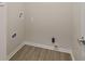 Laundry room with washer and dryer hookups and laminate flooring at 3119 Earlswood Ln, Indianapolis, IN 46217