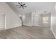 Bright living room features vaulted ceilings, modern light fixtures, wood flooring, and fresh paint at 3119 Earlswood Ln, Indianapolis, IN 46217