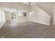 Spacious living room with modern flooring, ample natural light, and staircase to the upper level at 3119 Earlswood Ln, Indianapolis, IN 46217