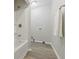 Bright bathroom featuring a tub-shower combination and a towel rack at 316 S Roena St, Indianapolis, IN 46241